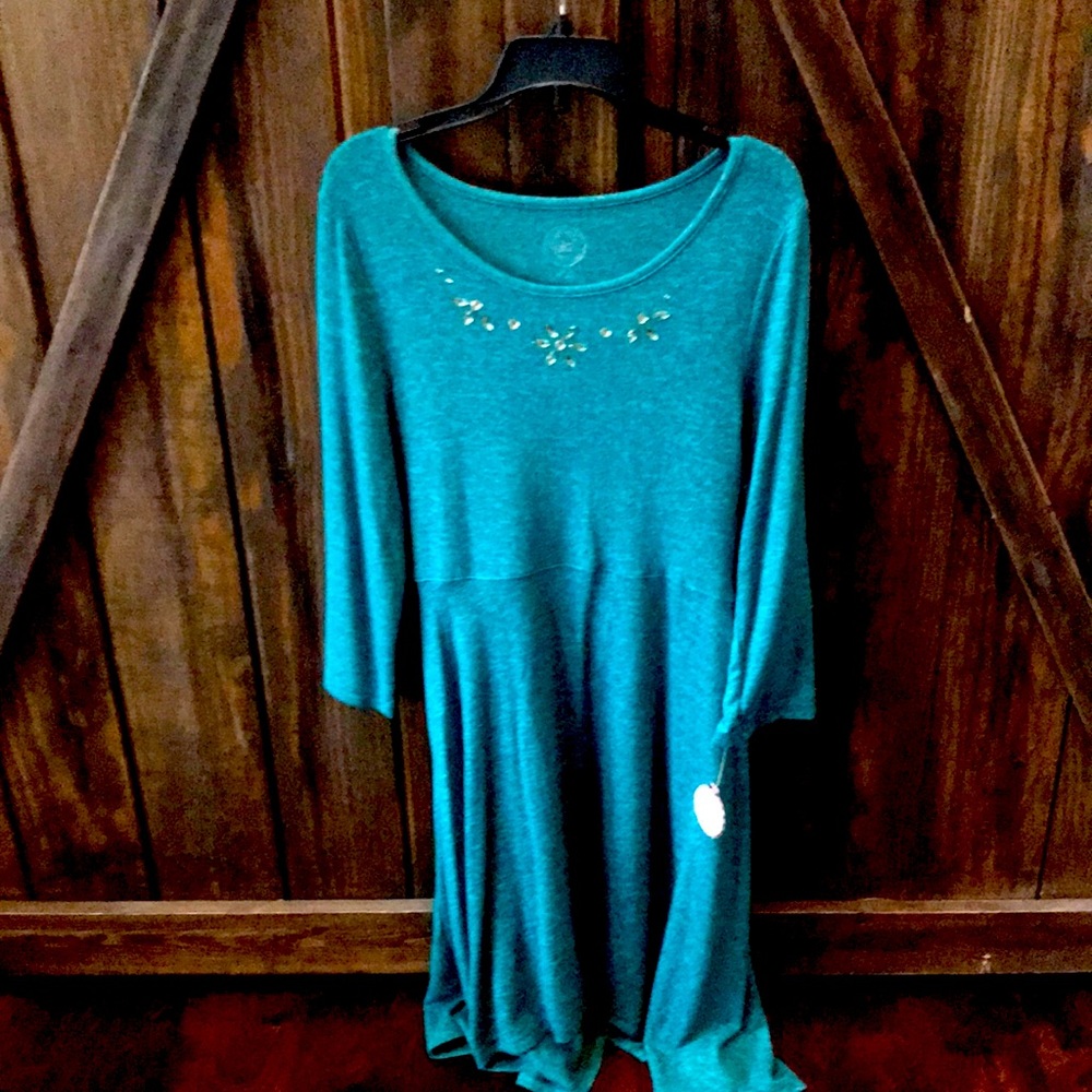 A dress that is blue with diamond design